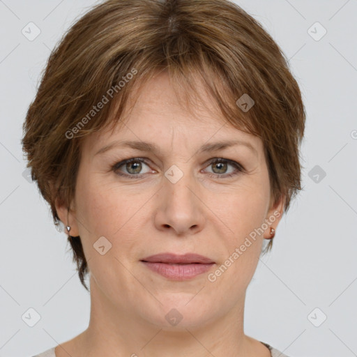 Joyful white adult female with medium  brown hair and green eyes