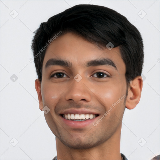 Joyful latino young-adult male with short  black hair and brown eyes