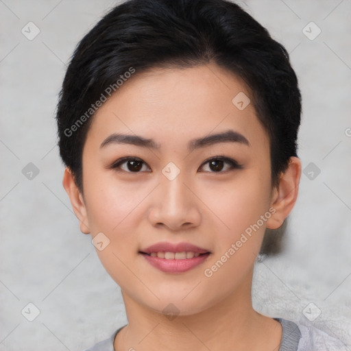 Joyful asian young-adult female with short  black hair and brown eyes