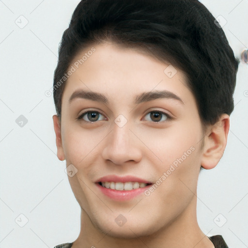 Joyful white young-adult female with short  brown hair and brown eyes