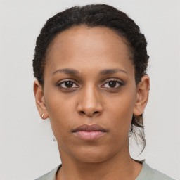 Neutral black young-adult female with short  brown hair and brown eyes