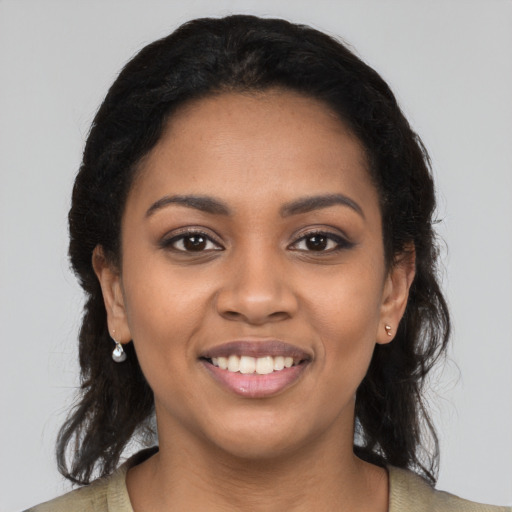 Joyful latino young-adult female with medium  black hair and brown eyes