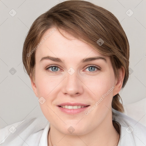 Joyful white young-adult female with medium  brown hair and blue eyes