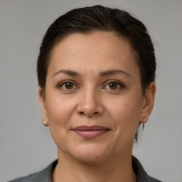 Joyful white adult female with short  brown hair and brown eyes