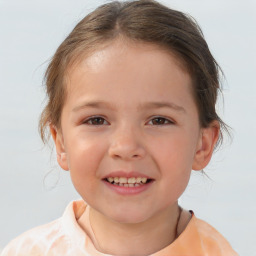 Joyful white child female with short  brown hair and brown eyes