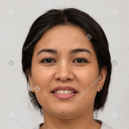 Joyful latino young-adult female with medium  brown hair and brown eyes