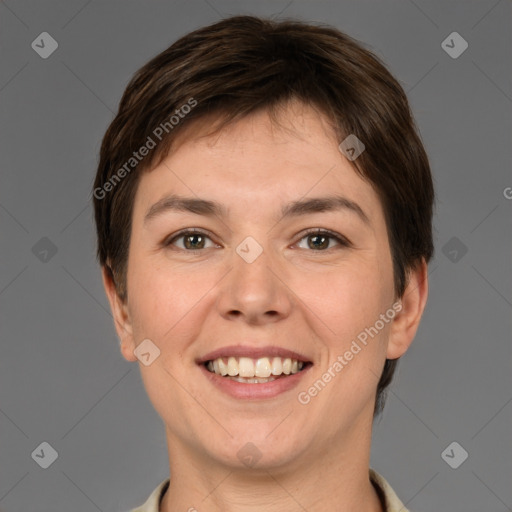 Joyful white young-adult female with short  brown hair and brown eyes