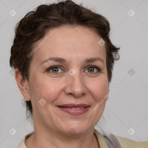 Joyful white adult female with short  brown hair and grey eyes