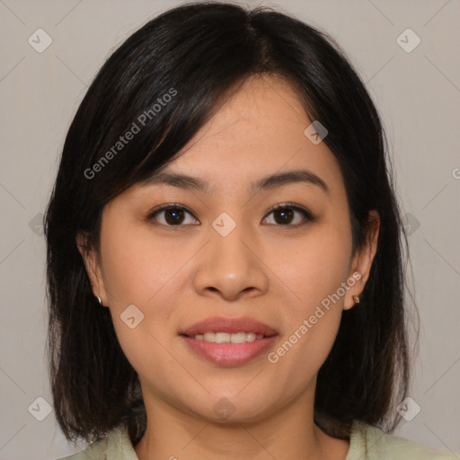 Joyful asian young-adult female with medium  brown hair and brown eyes