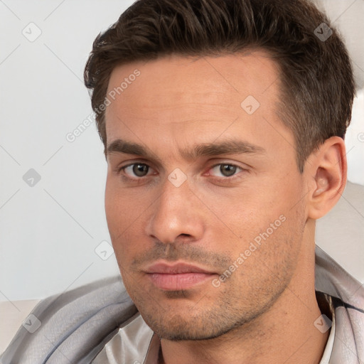 Neutral white young-adult male with short  brown hair and brown eyes