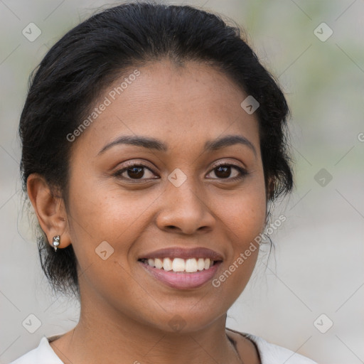 Joyful latino young-adult female with medium  brown hair and brown eyes