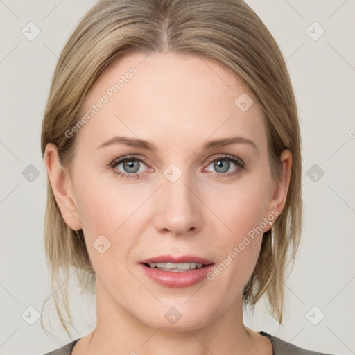 Joyful white young-adult female with medium  brown hair and blue eyes