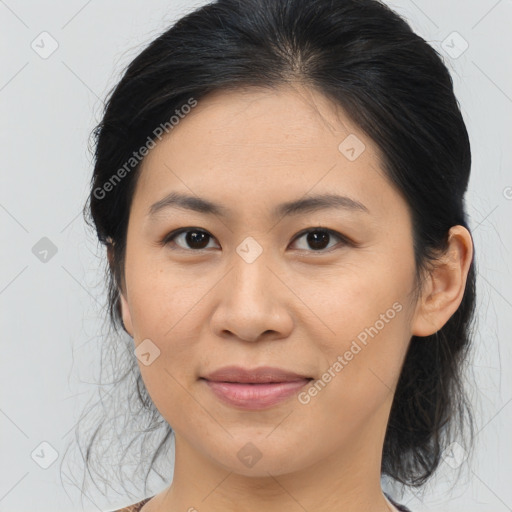 Joyful asian young-adult female with medium  brown hair and brown eyes