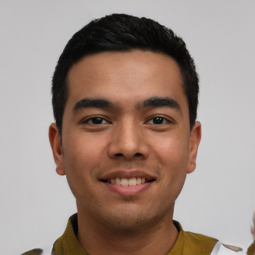 Joyful asian young-adult male with short  black hair and brown eyes