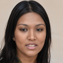 Joyful asian young-adult female with long  brown hair and brown eyes