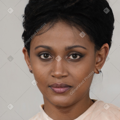 Joyful black young-adult female with short  brown hair and brown eyes