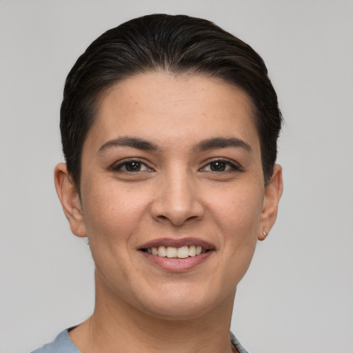 Joyful white young-adult female with short  brown hair and brown eyes