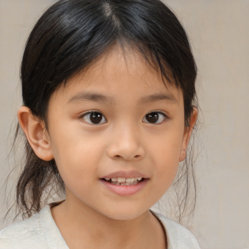 Joyful asian child female with medium  brown hair and brown eyes