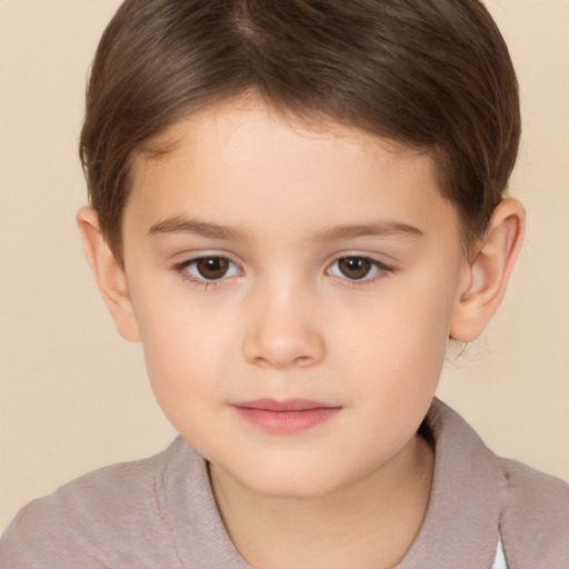 Joyful white child female with short  brown hair and brown eyes