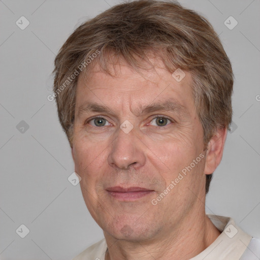 Joyful white middle-aged male with short  brown hair and brown eyes