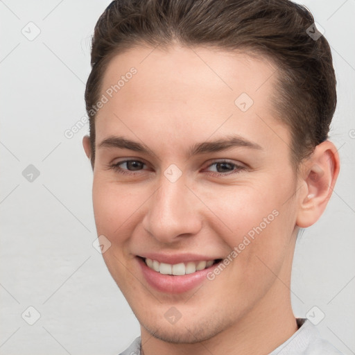 Joyful white young-adult female with short  brown hair and brown eyes