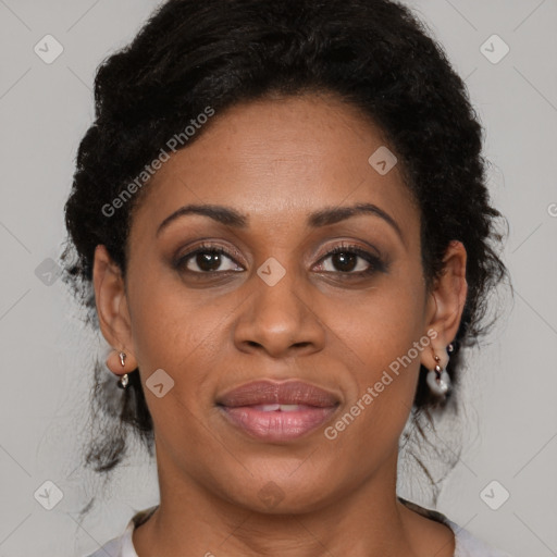 Joyful latino adult female with medium  brown hair and brown eyes