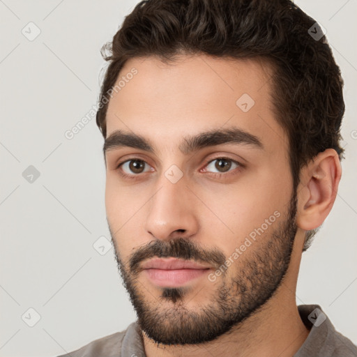 Neutral white young-adult male with short  brown hair and brown eyes