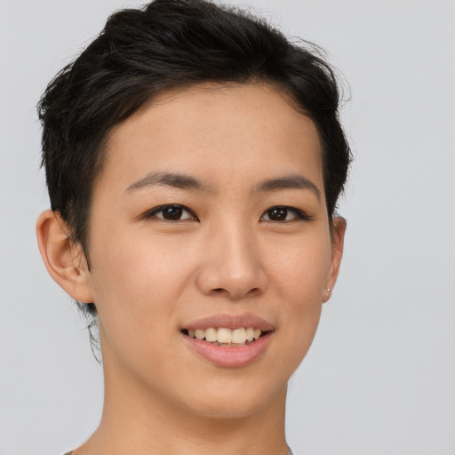 Joyful asian young-adult female with short  brown hair and brown eyes