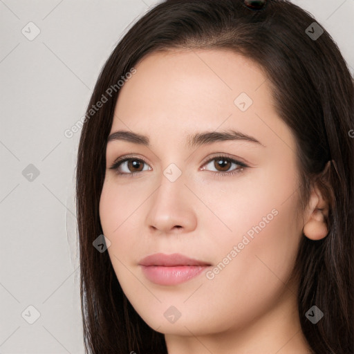 Neutral white young-adult female with long  brown hair and brown eyes