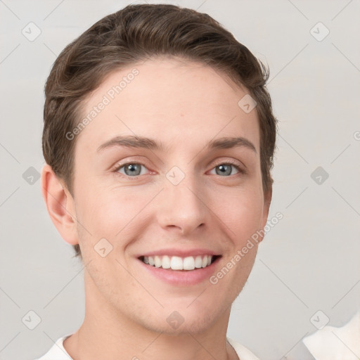 Joyful white young-adult female with short  brown hair and grey eyes