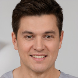 Joyful white young-adult male with short  brown hair and brown eyes