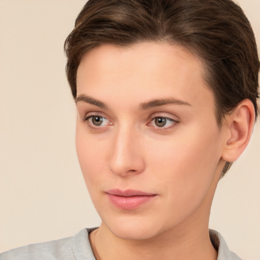 Neutral white young-adult female with short  brown hair and brown eyes