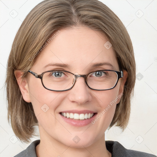 Joyful white adult female with medium  brown hair and blue eyes