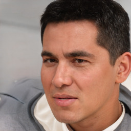 Neutral white young-adult male with short  black hair and brown eyes