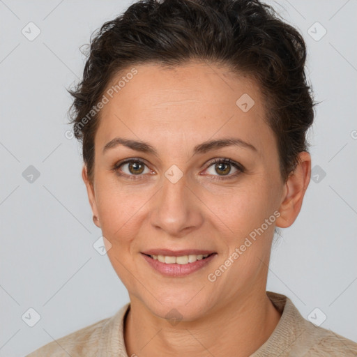 Joyful white adult female with short  brown hair and brown eyes