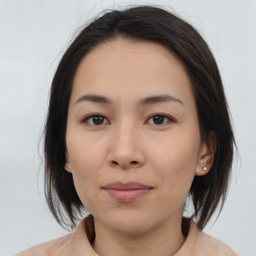 Neutral asian young-adult female with medium  brown hair and brown eyes