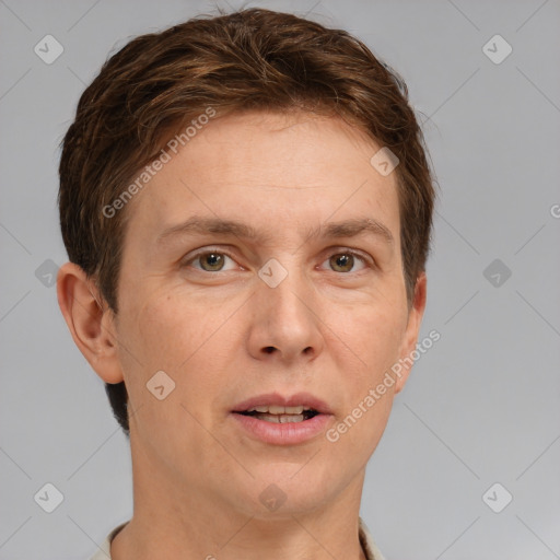 Joyful white adult female with short  brown hair and grey eyes