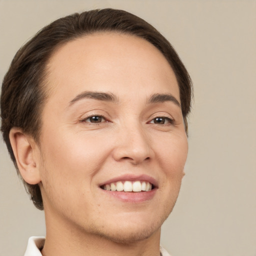 Joyful white young-adult female with short  brown hair and brown eyes