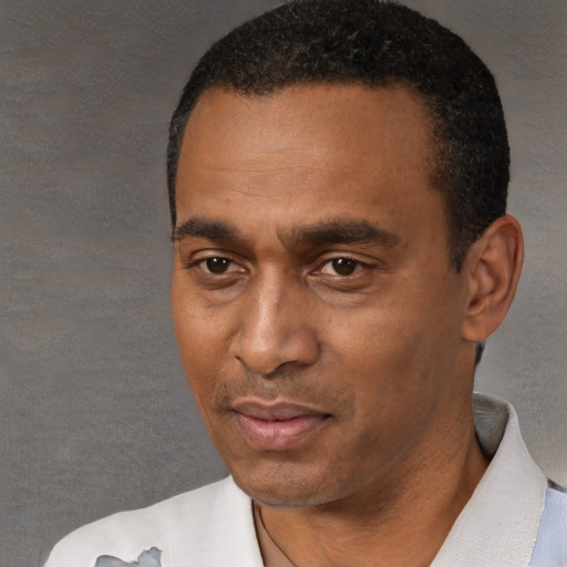 Neutral black adult male with short  black hair and brown eyes