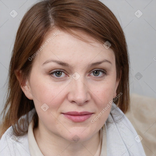 Joyful white adult female with medium  brown hair and grey eyes