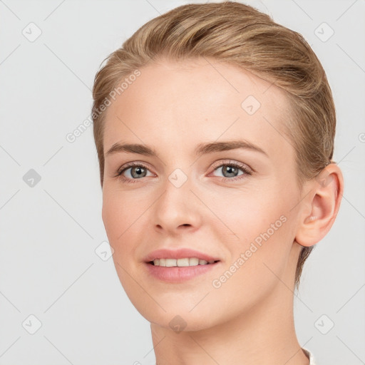 Joyful white young-adult female with short  brown hair and grey eyes