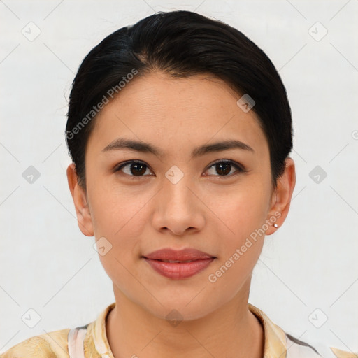 Joyful latino young-adult female with short  brown hair and brown eyes