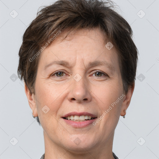 Joyful white adult female with short  brown hair and brown eyes