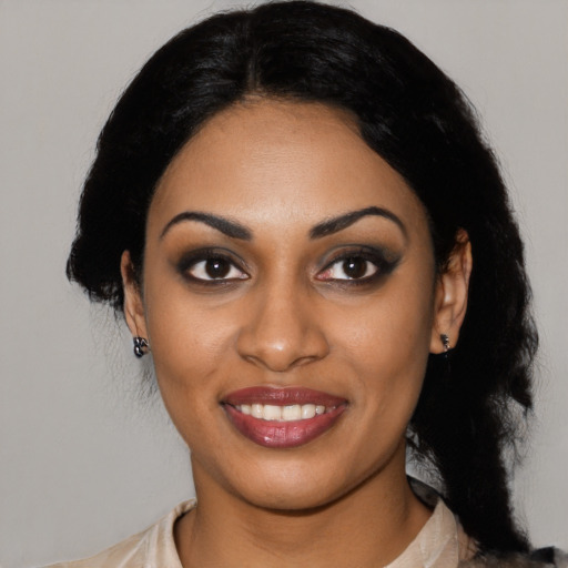 Joyful latino young-adult female with medium  black hair and brown eyes
