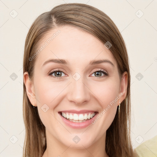 Joyful white young-adult female with long  brown hair and green eyes