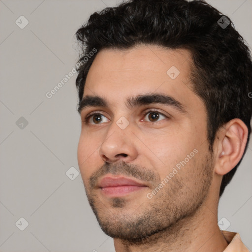 Joyful white young-adult male with short  black hair and brown eyes