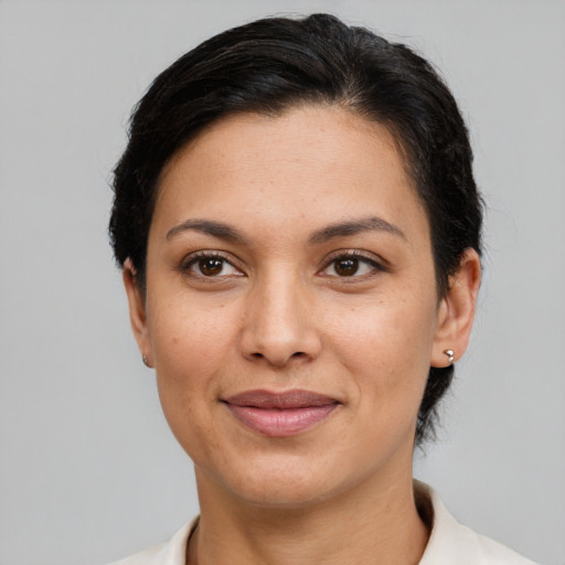 Joyful white adult female with short  brown hair and brown eyes