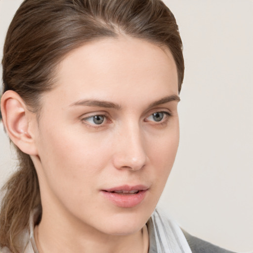 Neutral white young-adult female with medium  brown hair and grey eyes