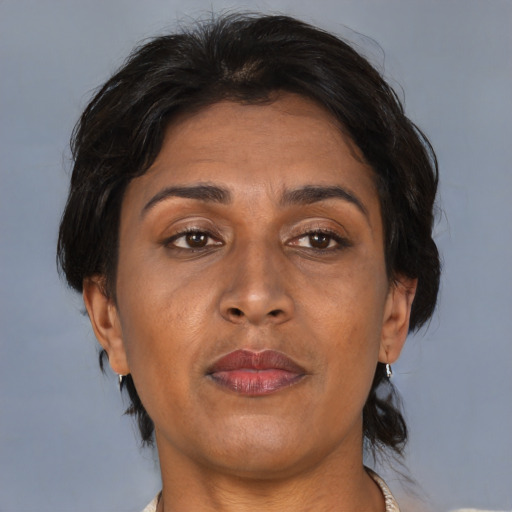 Joyful asian adult female with medium  brown hair and brown eyes