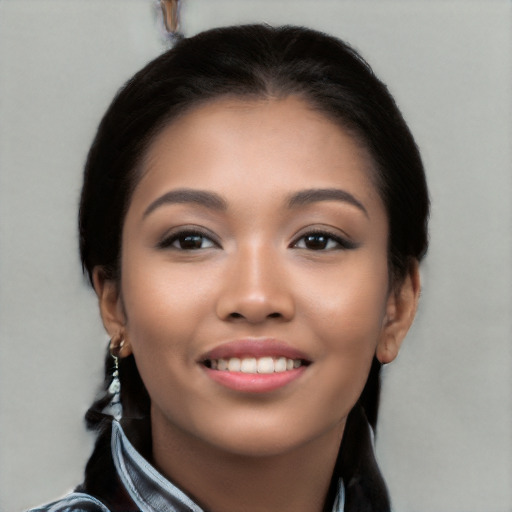 Joyful white young-adult female with long  black hair and brown eyes